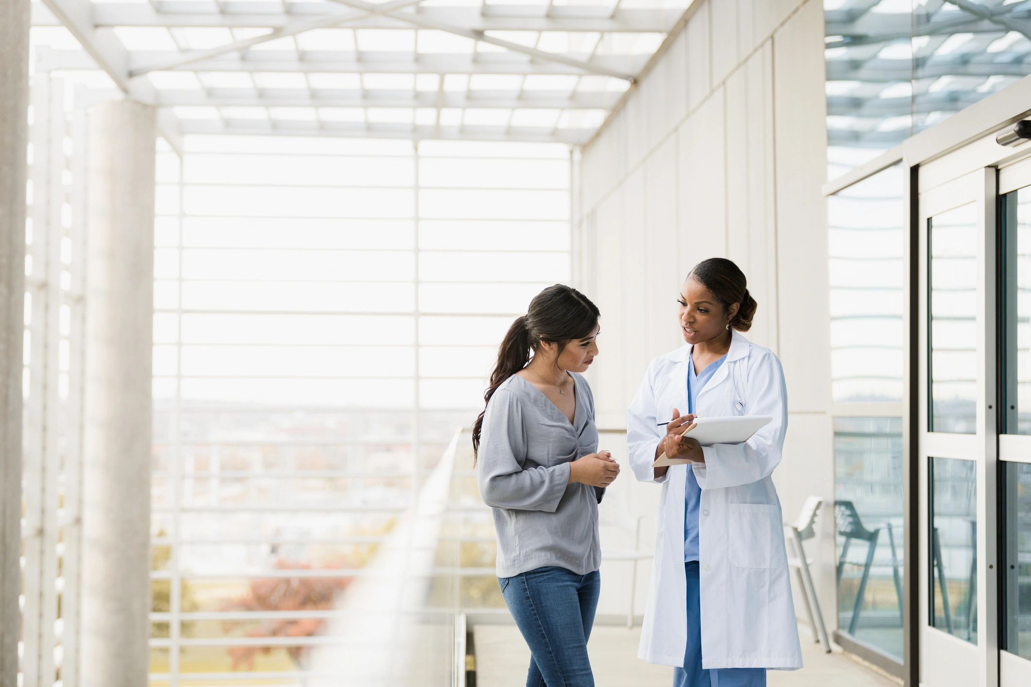 Doctor explaining test results to a patient and family member