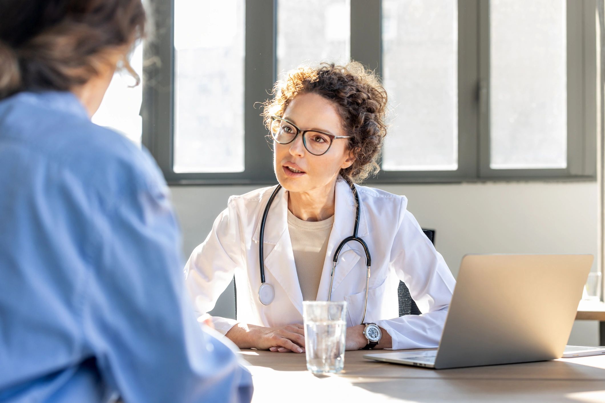 Doctor consulting patient in modern clinic