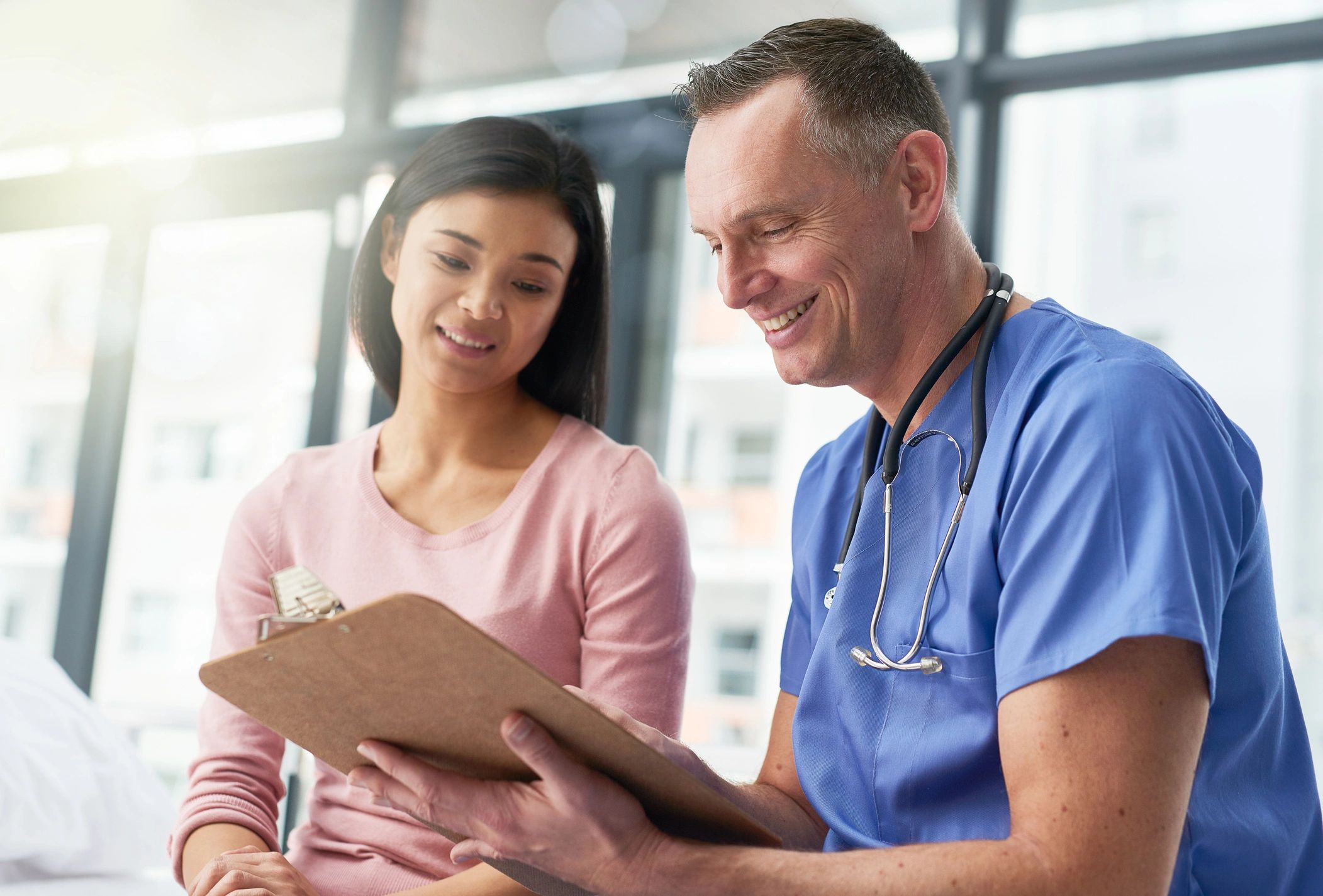 Doctor speaking reassuringly with a patient